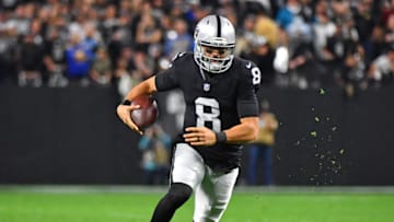 Jan 9, 2022; Paradise, Nevada, USA; Las Vegas Raiders quarterback Marcus Mariota (8) rushes with the ball during the fourth quarter against the Los Angeles Chargers at Allegiant Stadium. Mandatory Credit: Stephen R. Sylvanie-USA TODAY Sports