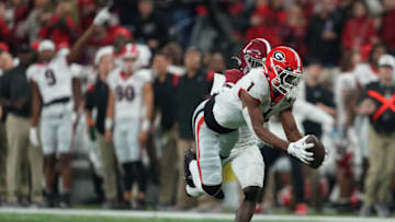 Jan 10, 2022; Indianapolis, IN, USA; Georgia Bulldogs wide receiver George Pickens (right) catches a 52 yard pass against Alabama Crimson Tide defensive back Kool-Aid McKinstry (left) during the first quarter of the 2022 CFP college football national championship game at Lucas Oil Stadium. Mandatory Credit: Kirby Lee-USA TODAY Sports