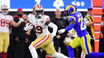 Jan 30, 2022; Inglewood, California, USA; San Francisco 49ers wide receiver Deebo Samuel (19) gets past Los Angeles Rams defensive back David Long (22) and scores a touchdown in the first half during the NFC Championship Game at SoFi Stadium. Mandatory Credit: Gary A. Vasquez-USA TODAY Sports