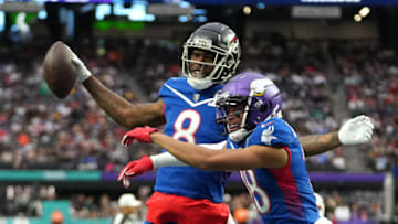 Feb 6, 2022; Paradise, Nevada, USA; NFC tight end Kyle Pitts of the Atlanta Falcons (8) celebrates with NFC wide receiver Justin Jefferson of the Minnesota Vikings (18) after scoring a touchdown during the Pro Bowl football game at Allegiant Stadium. Mandatory Credit: Stephen R. Sylvanie-USA TODAY Sports