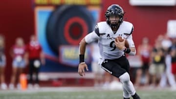Cincinnati Bearcats quarterback Desmond Ridder (9) runs through a hole in the fourth quarter of the NCAA football game between the Indiana Hoosiers and the Cincinnati Bearcats at Memorial Stadium in Bloomington, Ind., on Saturday, Sept. 18, 2021.Cincinnati Bearcats At Indiana Hoosiers Football