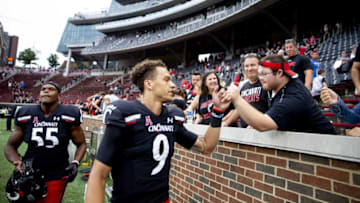Cincinnati Bearcats quarterback Desmond Ridder (9) fist bumps a fan after the NCAA football game on Saturday, Sept. 4, 2021, at Nippert Stadium in Cincinnati.Cincinnati Bearcats Miami Redhawks