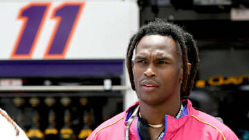 Jul 10, 2022; Hampton, Georgia, USA; Former Falcons receiver Julio Jones stands on the grid prior to the Quaker State 400 at Atlanta Motor Speedway. Mandatory Credit: Adam Hagy-USA TODAY Sports