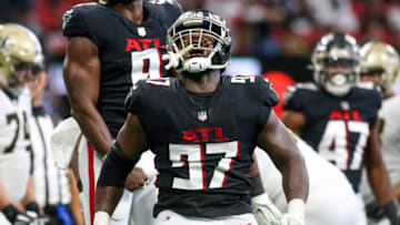 Sep 11, 2022; Atlanta, Georgia, USA; Atlanta Falcons defensive end Grady Jarrett (97) celebrates after a sack against the New Orleans Saints in the second quarter at Mercedes-Benz Stadium. Mandatory Credit: Brett Davis-USA TODAY Sports