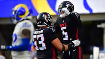 Sep 18, 2022; Inglewood, California, USA; Atlanta Falcons wide receiver Drake London (5) is congratulated by guard Chris Lindstrom (63) after catching a pass for two point conversion against the Los Angeles Rams during the second half at SoFi Stadium. Mandatory Credit: Gary A. Vasquez-USA TODAY Sports