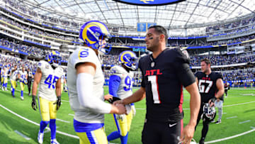 Sep 18, 2022; Inglewood, California, USA; Los Angeles Rams quarterback Matthew Stafford (9) meets with Atlanta Falcons quarterback Marcus Mariota (1) following the victory at SoFi Stadium. Mandatory Credit: Gary A. Vasquez-USA TODAY Sports