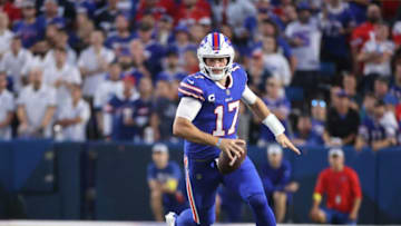 Bills quarterback Josh Allen rolls to his left.