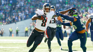 Sep 25, 2022; Seattle, Washington, USA; Atlanta Falcons tight end Kyle Pitts (8) runs for yards after the catch against Seattle Seahawks linebacker Jordyn Brooks (56) during the first quarter at Lumen Field. Mandatory Credit: Joe Nicholson-USA TODAY Sports