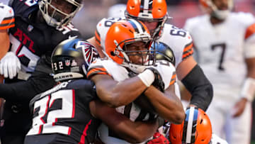 Oct 2, 2022; Atlanta, Georgia, USA; Cleveland Browns running back Nick Chubb (24) is tackled by Atlanta Falcons safety Jaylinn Hawkins (32) at Mercedes-Benz Stadium. Mandatory Credit: Dale Zanine-USA TODAY Sports