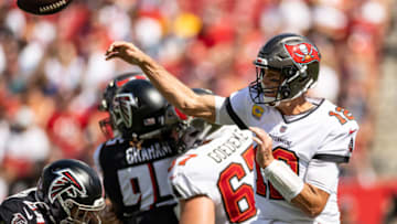 Oct 9, 2022; Tampa, Florida, USA; Tampa Bay Buccaneers quarterback Tom Brady (12) throws the ball under pressure during the second half against the Atlanta Falcons at Raymond James Stadium. Mandatory Credit: Matt Pendleton-USA TODAY Sports