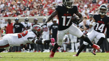 Oct 9, 2022; Tampa, Florida, USA; Atlanta Falcons wide receiver Olamide Zaccheaus (17) runs the ball in for a touchdown as Tampa Bay Buccaneers safety Mike Edwards (32) defends during the second half at Raymond James Stadium. Mandatory Credit: Kim Klement-USA TODAY Sports