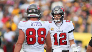 Tom Brady (12) of the Tampa Bay Buccaneers talks to tight end Cade Otton (88) after he is called offsides during the second half against the Pittsburgh Steelers at Acrisure Stadium in Pittsburgh, PA on October 16, 2022.Pittsburgh Steelers Vs Tampa Bay Buccaneers Week 6