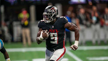 Oct 30, 2022; Atlanta, Georgia, USA; Atlanta Falcons linebacker Lorenzo Carter (9) returns a pass interception for a touchdown against the Carolina Panthers during the first half at Mercedes-Benz Stadium. Mandatory Credit: Dale Zanine-USA TODAY Sports