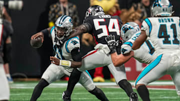 Oct 30, 2022; Atlanta, Georgia, USA; Carolina Panthers quarterback PJ Walker (11) is sacked by Atlanta Falcons linebacker Rashaan Evans (54) during the second half at Mercedes-Benz Stadium. Mandatory Credit: Dale Zanine-USA TODAY Sports
