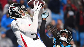 Nov 10, 2022; Charlotte, North Carolina, USA; Atlanta Falcons wide receiver Drake London (5) catches a touchdown as Carolina Panthers cornerback Donte Jackson (26) defends in the third quarter at Bank of America Stadium. Mandatory Credit: Bob Donnan-USA TODAY Sports