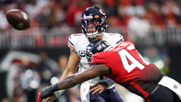 Nov 20, 2022; Atlanta, Georgia, USA; Chicago Bears quarterback Justin Fields (1) is hit by Atlanta Falcons defensive end Arnold Ebiketie (47) after a pitch in the second half at Mercedes-Benz Stadium. Mandatory Credit: Brett Davis-USA TODAY Sports