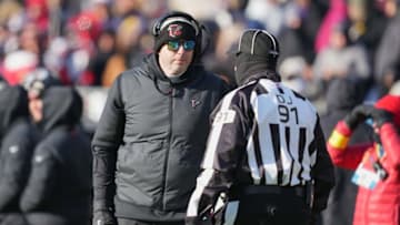 Dec 24, 2022; Baltimore, Maryland, USA; Atlanta Falcons head coach Arthur Smith talks with down judge Jerry Bergman (91) during a touchdown review in the second quarter against the Baltimore Ravens at M&T Bank Stadium. Mandatory Credit: Mitch Stringer-USA TODAY Sports