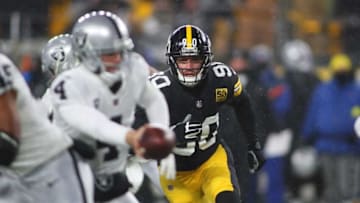 Pittsburgh Steelers T.J. Watt (90) keeps his eyes on Las Vegas Raiders Derek Carr (4) during the first half at Acrisure Stadium in Pittsburgh, PA on December 24, 2022.Pittsburgh Steelers Vs Las Vegas Raiders Week 16