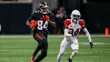 Jan 1, 2023; Atlanta, Georgia, USA; Atlanta Falcons running back Cordarrelle Patterson (84) runs past Arizona Cardinals safety Jalen Thompson (34) during the second half at Mercedes-Benz Stadium. Mandatory Credit: Dale Zanine-USA TODAY Sports