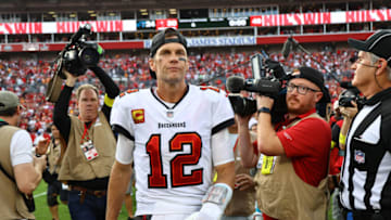 Jan 1, 2023; Tampa, Florida, USA; Tampa Bay Buccaneers quarterback Tom Brady (12) runs off the field after they beat the Carolina Panthers t Raymond James Stadium. Mandatory Credit: Kim Klement-USA TODAY Sports