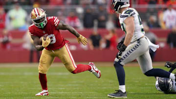 Jan 14, 2023; Santa Clara, California, USA; San Francisco 49ers wide receiver Deebo Samuel (19) is defended by Seattle Seahawks linebacker Cody Barton (57) in the fourth quarter of a wild card game at Levi's Stadium. Mandatory Credit: Cary Edmondson-USA TODAY Sports