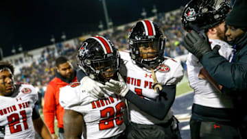 Austin Peay Governors defensive back Erskine Francis (1) comforts Austin Peay Governors defensive back Juantarius Bryant (26) as the Governors walk off the field having been defeated in a FCS playoff game between the Austin Peay Governors and Montana State Bobcats at Bobcat Stadium in Bozeman, MT., on Friday, Dec. 13, 2019.Hpt Year In Pictures 29
