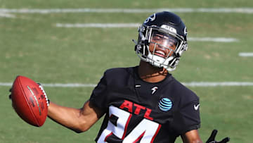 Aug 27, 2020; Flowery Branch, GA, USA; Atlanta Falcons cornerback A.J. Terrell comes up with the pick while running a defensive drill during training camp on Thursday, August 27, 2020 in Flowery Branch. Mandatory Credit: Curtis Compton/Pool Photo-USA TODAY Sports