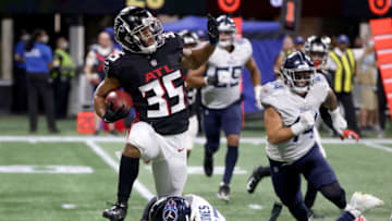 Aug 13, 2021; Atlanta, Georgia, USA; Atlanta Falcons cornerback Avery Williams (35) returns a kick off as he is tackled by Tennessee Titans cornerback Chris Jones (23) during the second half at Mercedes-Benz Stadium. Mandatory Credit: Jason Getz-USA TODAY Sports