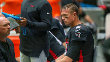 Oct 31, 2021; Atlanta, Georgia, USA; Atlanta Falcons quarterback Matt Ryan (2) with a trainer on the bench against the Carolina Panthers in the second quarter at Mercedes-Benz Stadium. Mandatory Credit: Brett Davis-USA TODAY Sports