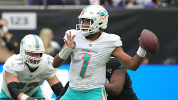 Oct 17, 2021; London, England, United Kingdom; Miami Dolphins quarterback Tua Tagovailoa (1) throws the ball in the first half against the Jacksonville Jaguars during an NFL International Series game at Tottenham Hotspur Stadium. Mandatory Credit: Kirby Lee-USA TODAY Sports