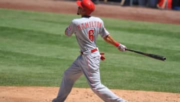 August 16, 2015; Los Angeles, CA, USA; Cincinnati Reds center fielder Billy Hamilton (6) hits a sacrifice RBI in the fifth inning against the Los Angeles Dodgers at Dodger Stadium. Mandatory Credit: Gary A. Vasquez-USA TODAY Sports