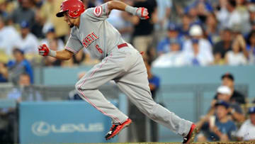 August 15, 2015; Los Angeles, CA, USA; Cincinnati Reds center fielder Billy Hamilton (6) runs to first after hitting a single in the fourth inning against the Los Angeles Dodgers at Dodger Stadium. Mandatory Credit: Gary A. Vasquez-USA TODAY Sports
