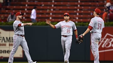 Sep 26, 2016; St. Louis, MO, USA; Cincinnati Reds left fielder Tyler Holt (40) center fielder Hernan Iribarren (33) and right fielder Steve Selsky (51) celebrate after the Reds defeated the St. Louis Cardinals at Busch Stadium. The Reds won 15-2. Mandatory Credit: Jeff Curry-USA TODAY Sports