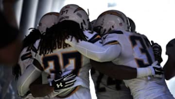 Sep 13, 2015; San Diego, CA, USA; San Diego Chargers defensive back Jahleel Addae (37), cornerback Brandon Flowers (24), free safety Eric Weddle (right) and cornerback Jason Verrett (left) embrace before the game against the Detroit Lions at Qualcomm Stadium. San Diego won 33-28. Mandatory Credit: Orlando Ramirez-USA TODAY Sports