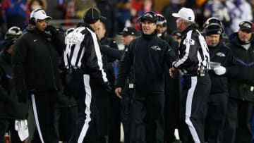 Jan 10, 2015; Foxborough, MA, USA; Baltimore Ravens head coach John Harbaugh discusses with the referees during the 2014 AFC Divisional playoff football game against the New England Patriots at Gillette Stadium. Mandatory Credit: Greg M. Cooper-USA TODAY Sports