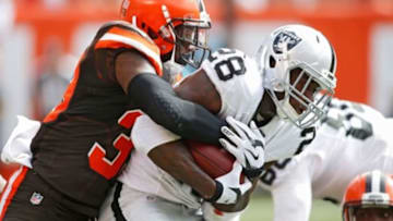 Sep 27, 2015; Cleveland, OH, USA; Cleveland Browns free safety Tashaun Gipson (39) tackles Oakland Raiders running back Latavius Murray (28) during the second quarter at FirstEnergy Stadium. Mandatory Credit: Scott R. Galvin-USA TODAY Sports