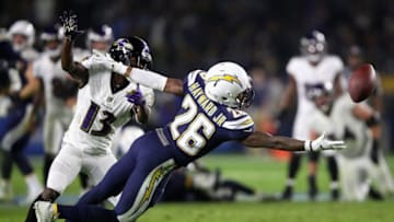 CARSON, CA - DECEMBER 22: Casey Hayward #26 of the Los Angeles Chargers breaks up a pass play intended for John Brown #13 of the Baltimore Ravens during the second half of a game at StubHub Center on December 22, 2018 in Carson, California. (Photo by Sean M. Haffey/Getty Images)