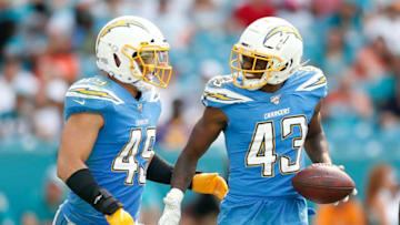 MIAMI, FLORIDA - SEPTEMBER 29: Michael Davis #43 of the Los Angeles Chargers celebrates with Drue Tranquill #49 after a interception against the Miami Dolphins during the fourth quarter at Hard Rock Stadium on September 29, 2019 in Miami, Florida. (Photo by Michael Reaves/Getty Images)