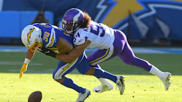 CARSON, CA - DECEMBER 15: Middle linebacker Eric Kendricks #54 of the Minnesota Vikings forces a fumble by running back Austin Ekeler #30 of the Los Angeles Chargers allowing defensive end Ifeadi Odenigbo #95 of the Minnesota Vikings to grab the ball and run for a touchdown in the second quarter of the game at Dignity Health Sports Park on December 15, 2019 in Carson, California. (Photo by Jayne Kamin-Oncea/Getty Images)