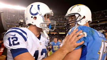 SAN DIEGO, CA - OCTOBER 14: Quarterback Philip Rivers #17 is congratulated by quarterback Andrew Luck #12 of the Indianapolis Colts at the end of the football game at Qualcomm Stadium October 14, 2013 in San Diego, California. (Photo by Kevork Djansezian/Getty Images)
