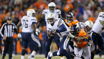 DENVER, CO - DECEMBER 12: Sylvester Williams #92 of the Denver Broncos sacks Philip Rivers #17 of the San Diego Chargers in the first quarter at Sports Authority Field at Mile High on December 12, 2013 in Denver, Colorado. (Photo by Justin Edmonds/Getty Images)