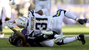 BALTIMORE, MARYLAND - JANUARY 06: Adrian Phillips #31 of the Los Angeles Chargers intercepts a pass by Lamar Jackson #8 of the Baltimore Ravens during the second quarter in the AFC Wild Card Playoff game at M&T Bank Stadium on January 06, 2019 in Baltimore, Maryland. (Photo by Patrick Smith/Getty Images)