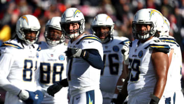 FOXBOROUGH, MASSACHUSETTS - JANUARY 13: Philip Rivers #17 of the Los Angeles Chargers reacts in the huddle during the second quarter in the AFC Divisional Playoff Game against the New England Patriots at Gillette Stadium on January 13, 2019 in Foxborough, Massachusetts. (Photo by Al Bello/Getty Images)