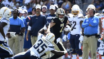 CARSON, CA - AUGUST 18: Quarterback Taysom Hill #7 of the New Orleans Saints rushes for a gain against Adarius Pickett #35 of the Los Angeles Chargers during the second half of their pre season football game at Dignity Health Sports Park on August 18, 2019 in Carson, California. (Photo by Kevork Djansezian/Getty Images)