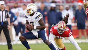 SANTA CLARA, CA - AUGUST 29: Cardale Jones #7 of the Los Angeles Chargers scrambles away from the pressure of Sheldon Day #96 of the San Francisco 49ers during the first quarter of an NFL football game at Levi's Stadium on August 29, 2019 in Santa Clara, California. (Photo by Thearon W. Henderson/Getty Images)