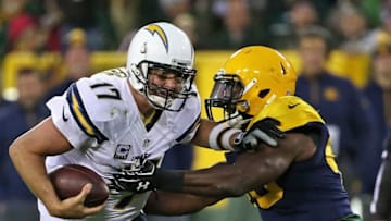 GREEN BAY, WI - OCTOBER 18: Philip Rivers #17 of the San Diego Chargers gets away from Joe Thomas #48 of the Green Bay Packers at Lambeau Field on October 18, 2015 in Green Bay, Wisconsin. The Packers defeated the Chargers 27-20. (Photo by Jonathan Daniel/Getty Images)