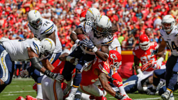 KANSAS CITY, MO - SEPTEMBER 11: Running back Melvin Gordon #28 of the San Diego Charger fights through tackle of inside linebacker Derrick Johnson #56 of the Kansas City Chiefs to score the games first touchdown during the first quarter at Arrowhead Stadium during the game on September 11, 2016 in Kansas City, Missouri. (Photo by Jamie Squire/Getty Images)