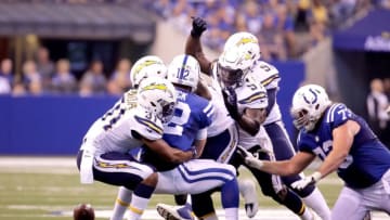 INDIANAPOLIS, IN - SEPTEMBER 25: Andrew Luck #12 of the Indianapolis Colts fumbles the ball during the second half of the game against the San Diego Chargers at Lucas Oil Stadium on September 25, 2016 in Indianapolis, Indiana. (Photo by Andy Lyons/Getty Images)