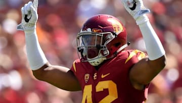 LOS ANGELES, CA - OCTOBER 08: Uchenna Nwosu #42 of the USC Trojans celebrates his blocked pass during the first quarter against the Colorado Buffaloes at Los Angeles Memorial Coliseum on October 8, 2016 in Los Angeles, California. (Photo by Harry How/Getty Images)