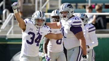 WACO, TX - NOVEMBER 19: Alex Barnes #34 of the Kansas State Wildcats celebrates his touchdown with Dalton Risner #71 of the Kansas State Wildcats against the Baylor Bears at McLane Stadium on November 19, 2016 in Waco, Texas. (Photo by Ronald Martinez/Getty Images)